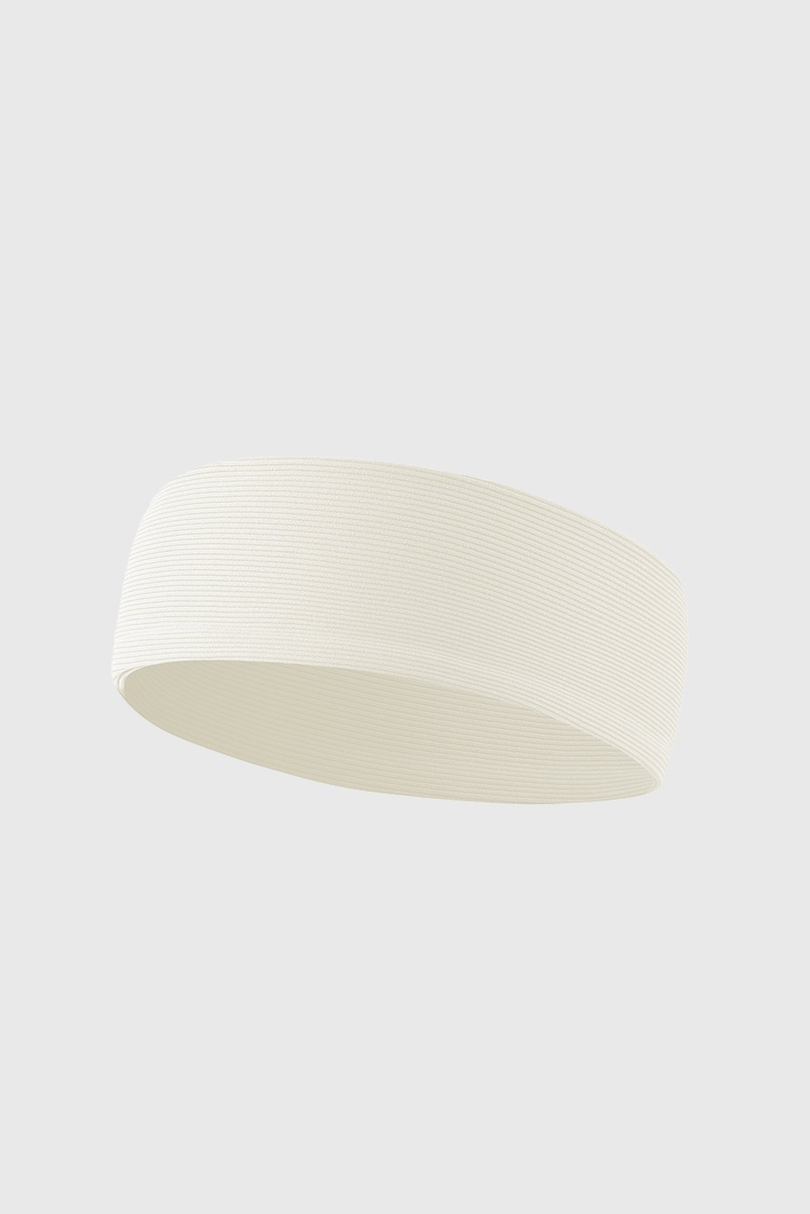 WISKII elastic sport headband in oat milk color, designed for active wear, featuring a comfortable, stretchy accessories fit.