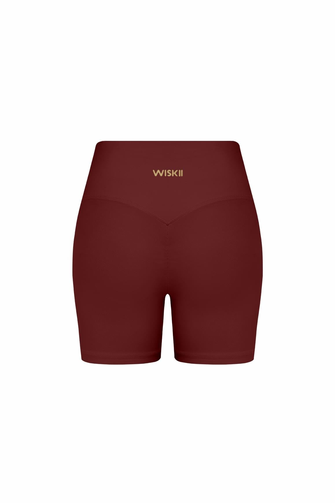 WISKII high-waist Vigor scrunch shorts in mulled wine color, showcasing the fitted design and stylish scrunch detailing.