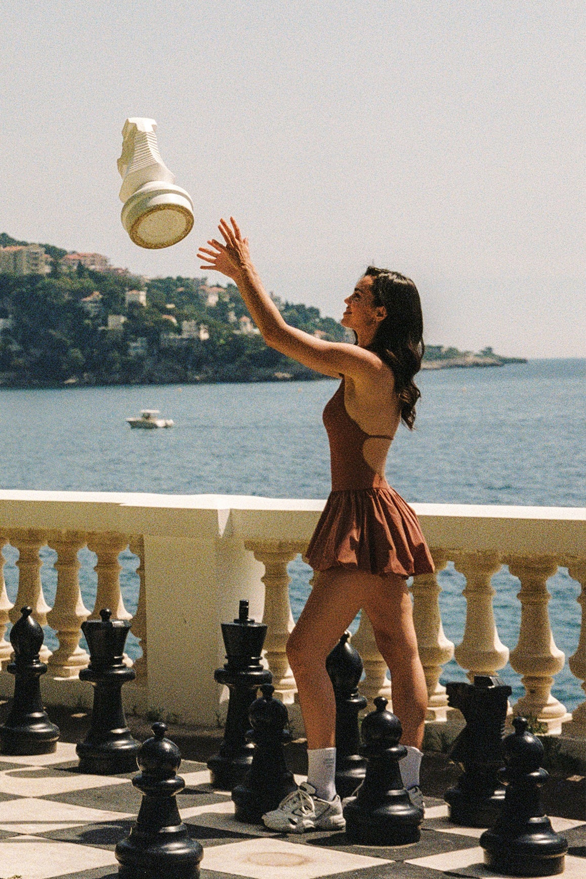 Model wears a Riviera Floral Halter Mock Neck Dress | Cinnamon | WISKII Active