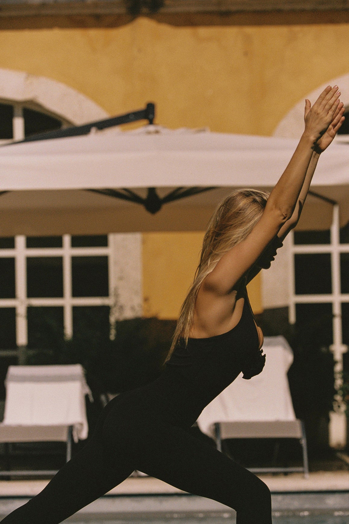 Model wears WISKII Halter-Neck Floral Tank Top | black tank top | WISKII Active