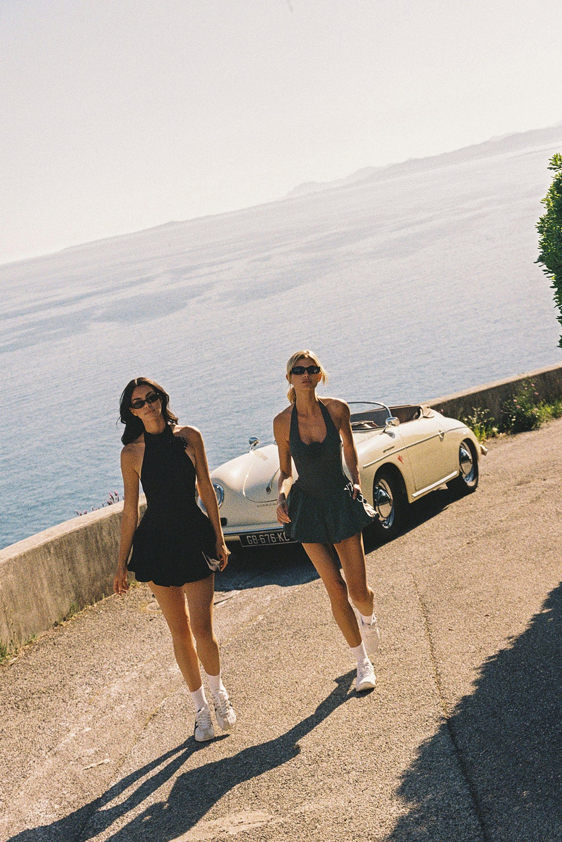 Model wears a Riviera Floral Halter Mock Neck Dress | Black | WISKII Active