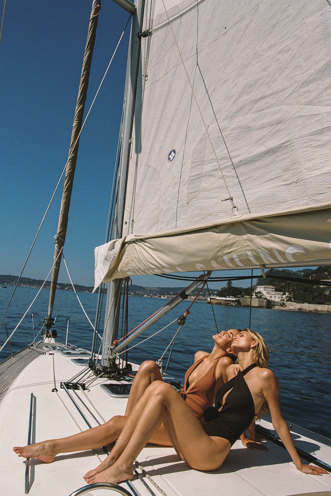Model wears a Riviera Floral Plunge One-Piece Swimsuit | Cinnamon Swimsuit | WISKII Active