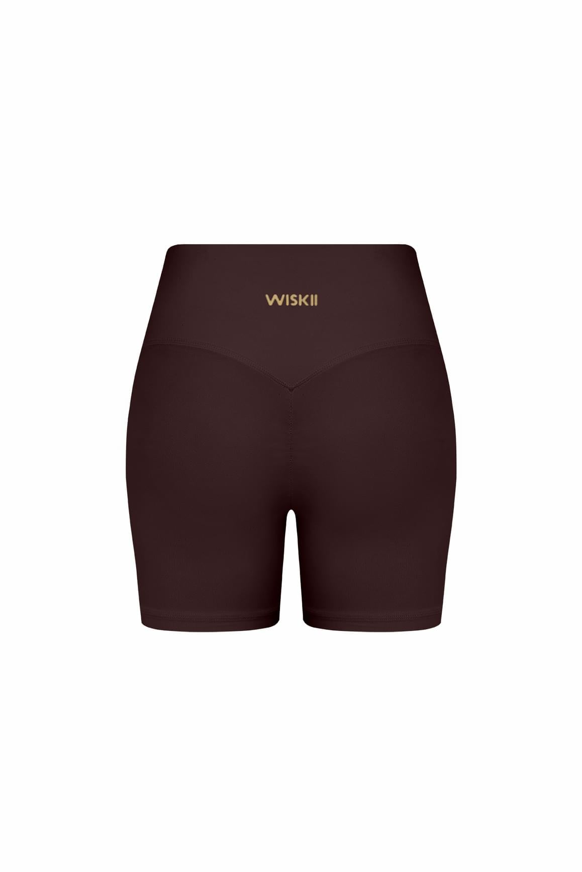 High-waist Vigor Scrunch Shorts by WISKII, featuring a fitted design and scrunch detail, shown in a vibrant athletic style.