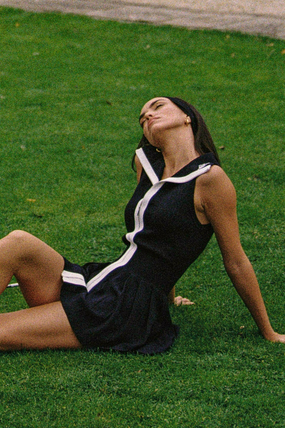 WISKII full-zip sleeveless dress featuring a sleek design, fitted silhouette, and stylish collar detail.