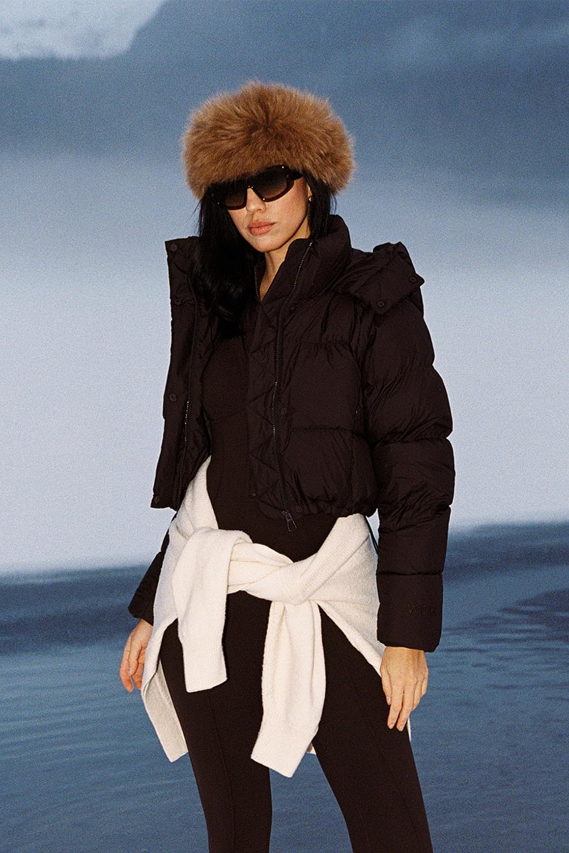 WISKII Cropped Convert Down Jacket in black, featuring a hood and puffy insulation, designed for stylish warmth and comfort.