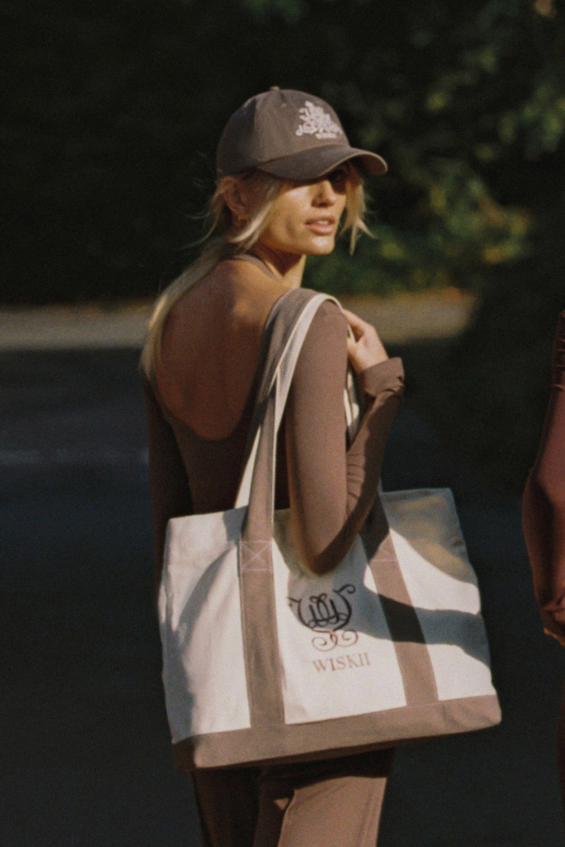 WISKII Duo Long Sleeve Top in soft fabric, featuring a fitted design and crew neckline, worn by a model in casual wear.