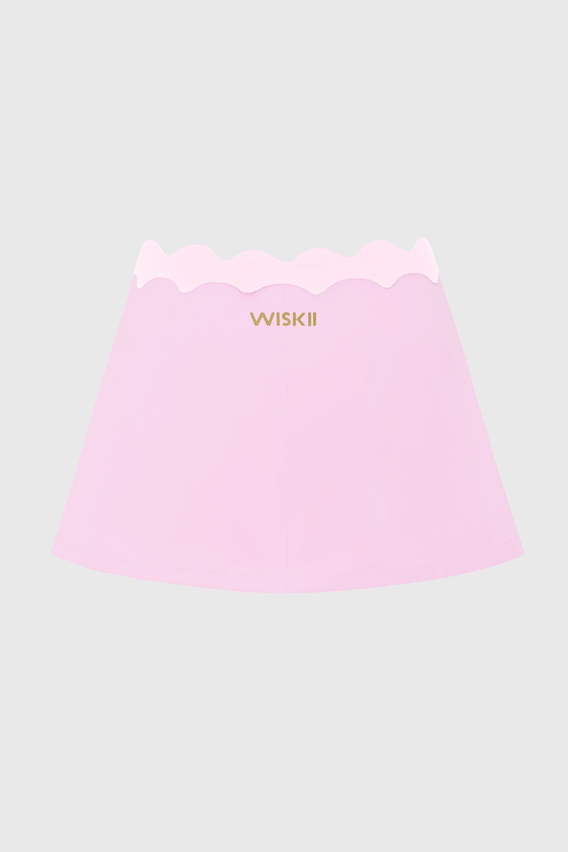 WISKII Riviera scallop contrast skirt with a flowy design and scalloped hem, shown in a stylish outdoor setting.