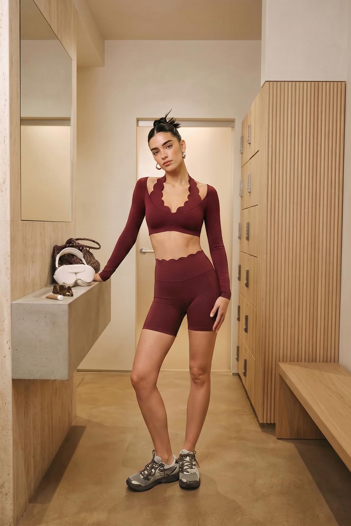 WISKII high-waist scallop scrunch shorts in mulled wine color, featuring a stylish scalloped hem and scrunch detail at the waist.