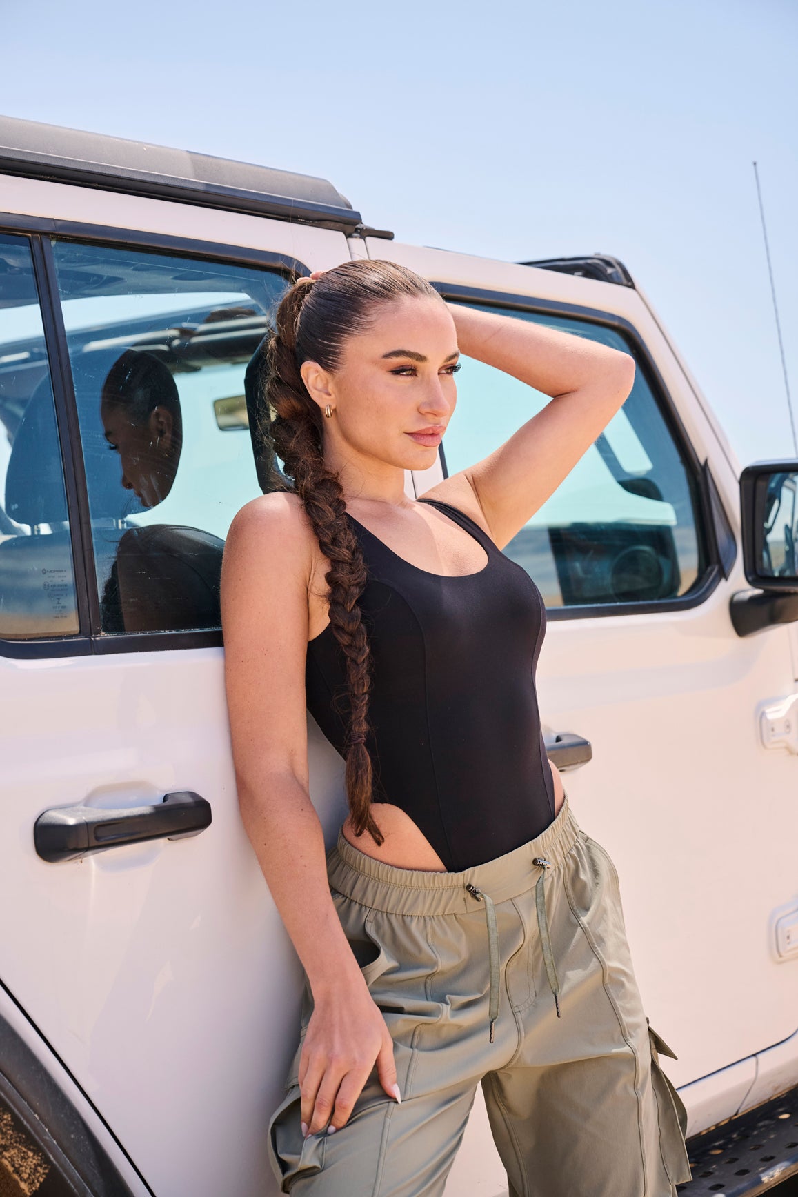 Model wears Scoop Neck Sleeveless Bodysuit | WISKII Active | Black