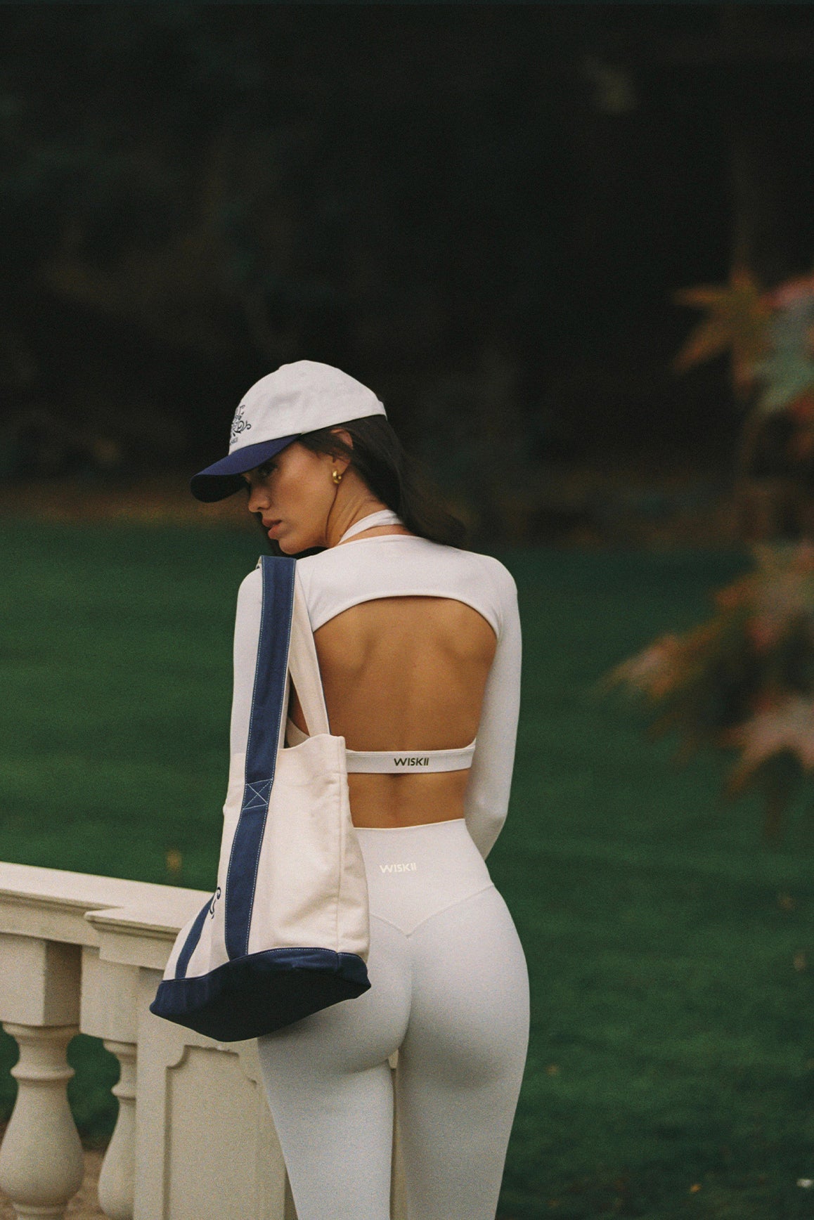 WISKII minimal long sleeve sports shrug in oat milk, featuring a sleek bolero design for active wear.