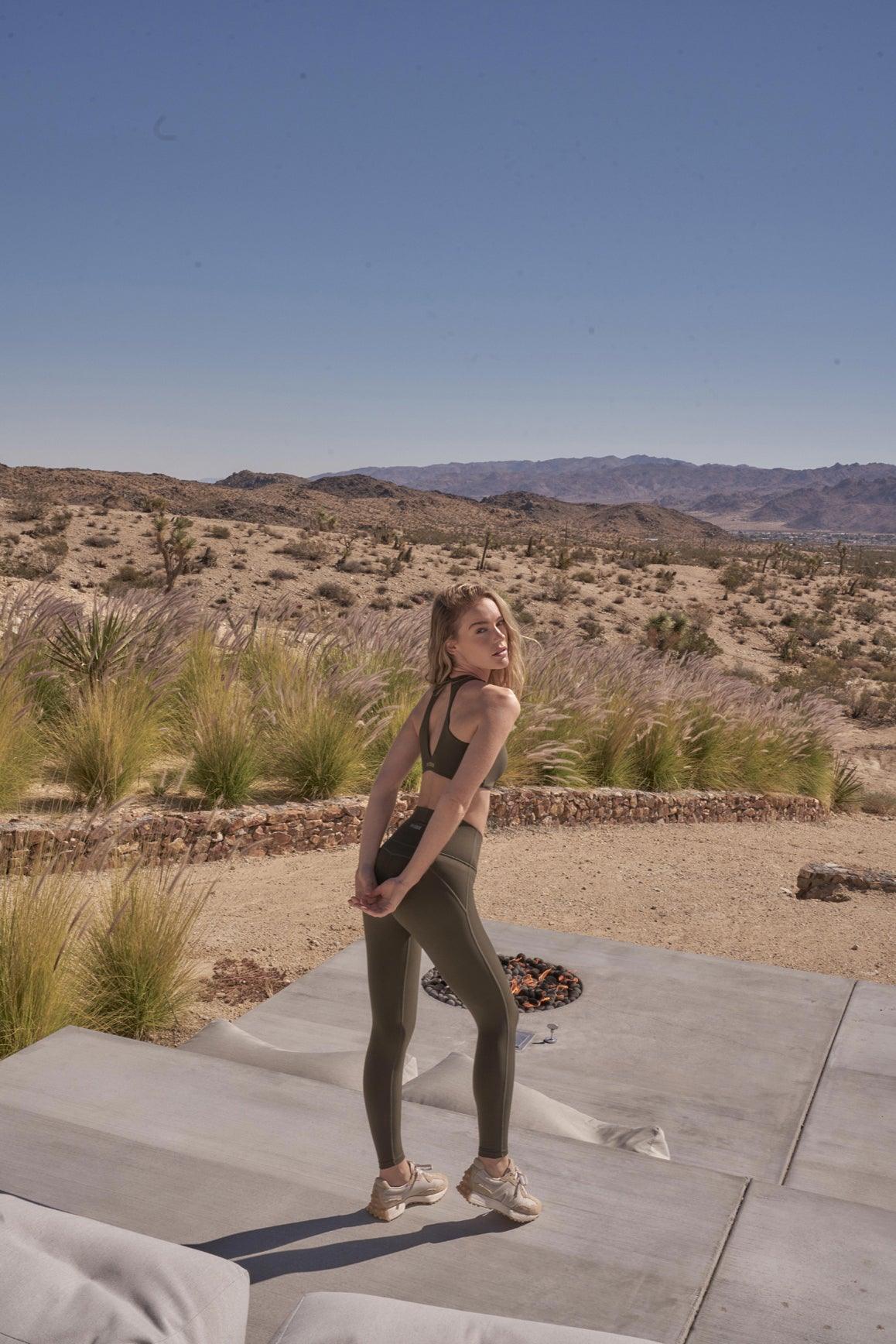 Model wears WISKII Ruched Sports Bra + V-waist Yoga Legging | WISKII