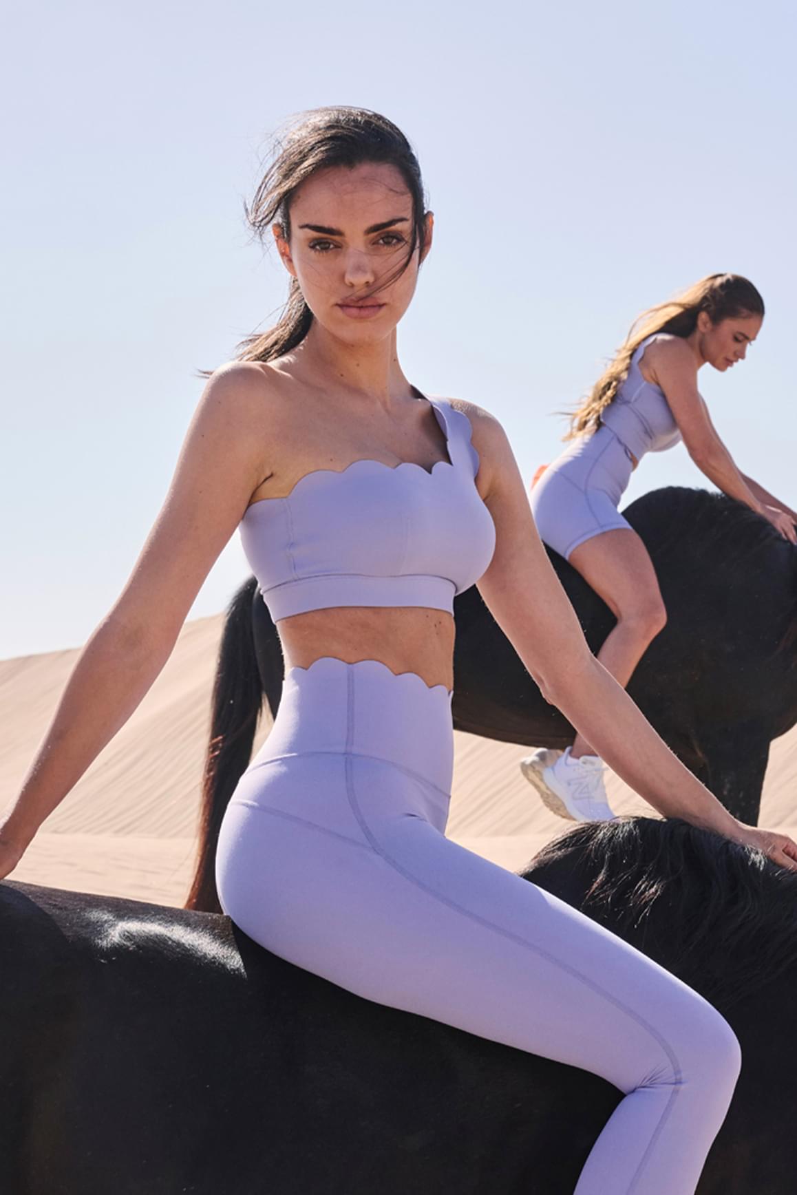 WISKII Elegant Scallop Outfit Bundle featuring a pink one-shoulder sports bra and matching leggings, stylish athletic wear.