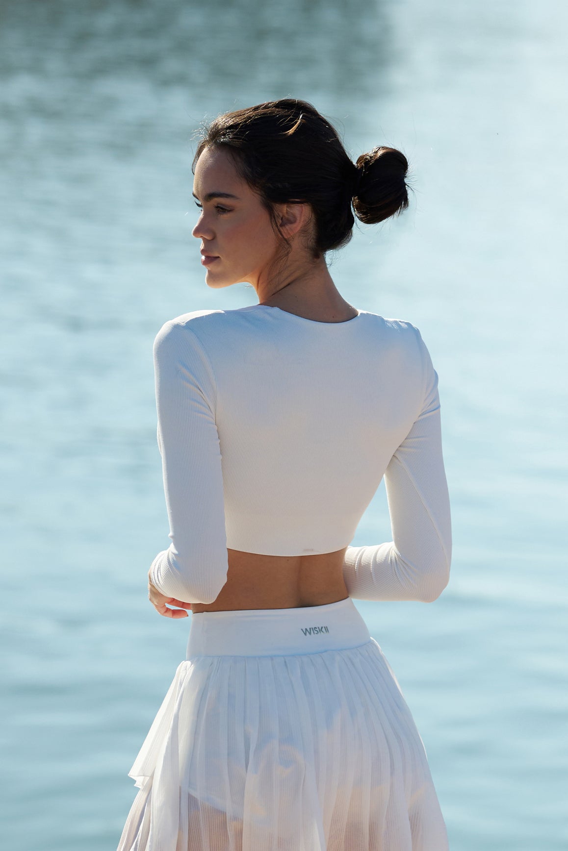 Model wears WISKII Elegant Long Sleeve Crop Top | Ivory