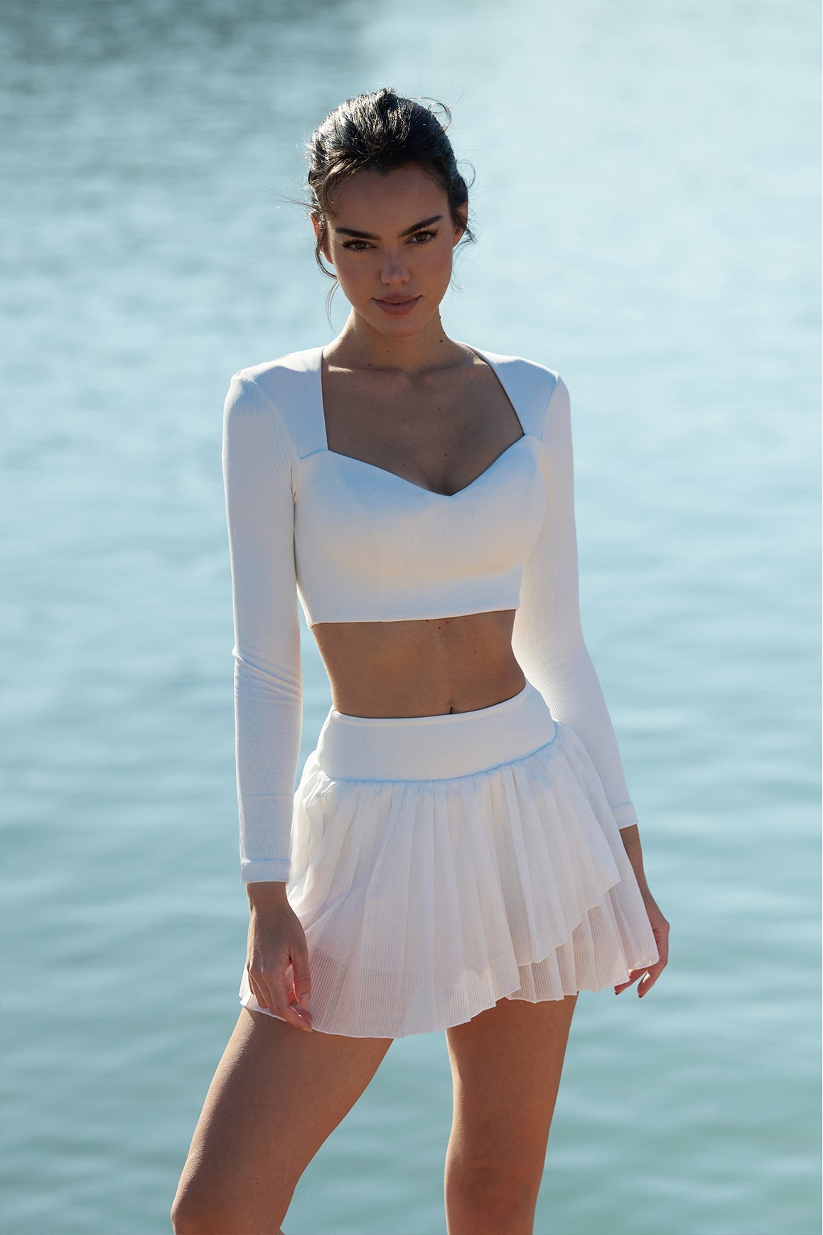 Model wears WISKII Elegant Long Sleeve Crop Top | Ivory