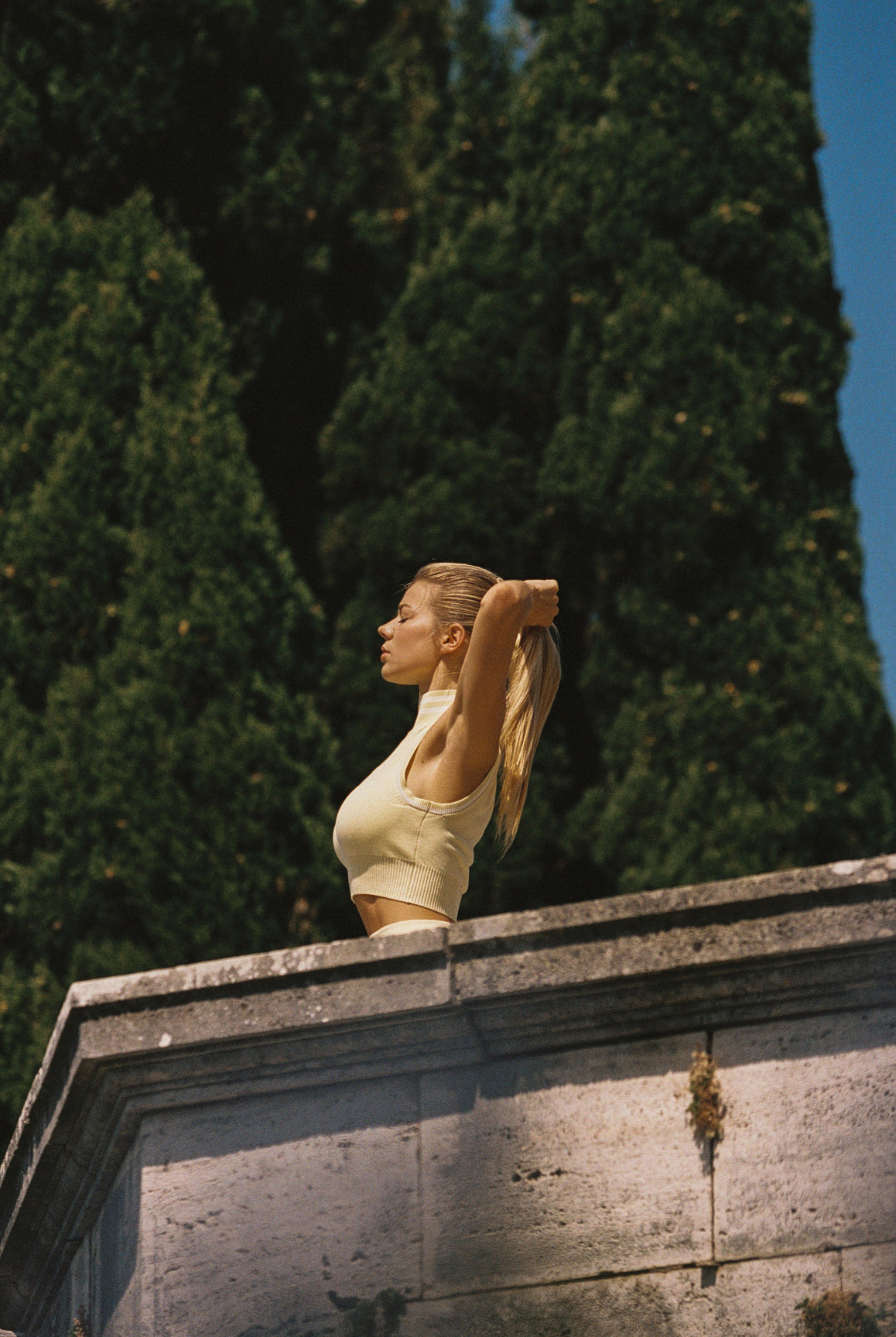 Model wears Mirto Knit Mock Neck Tank | Lemon | WISKII Active