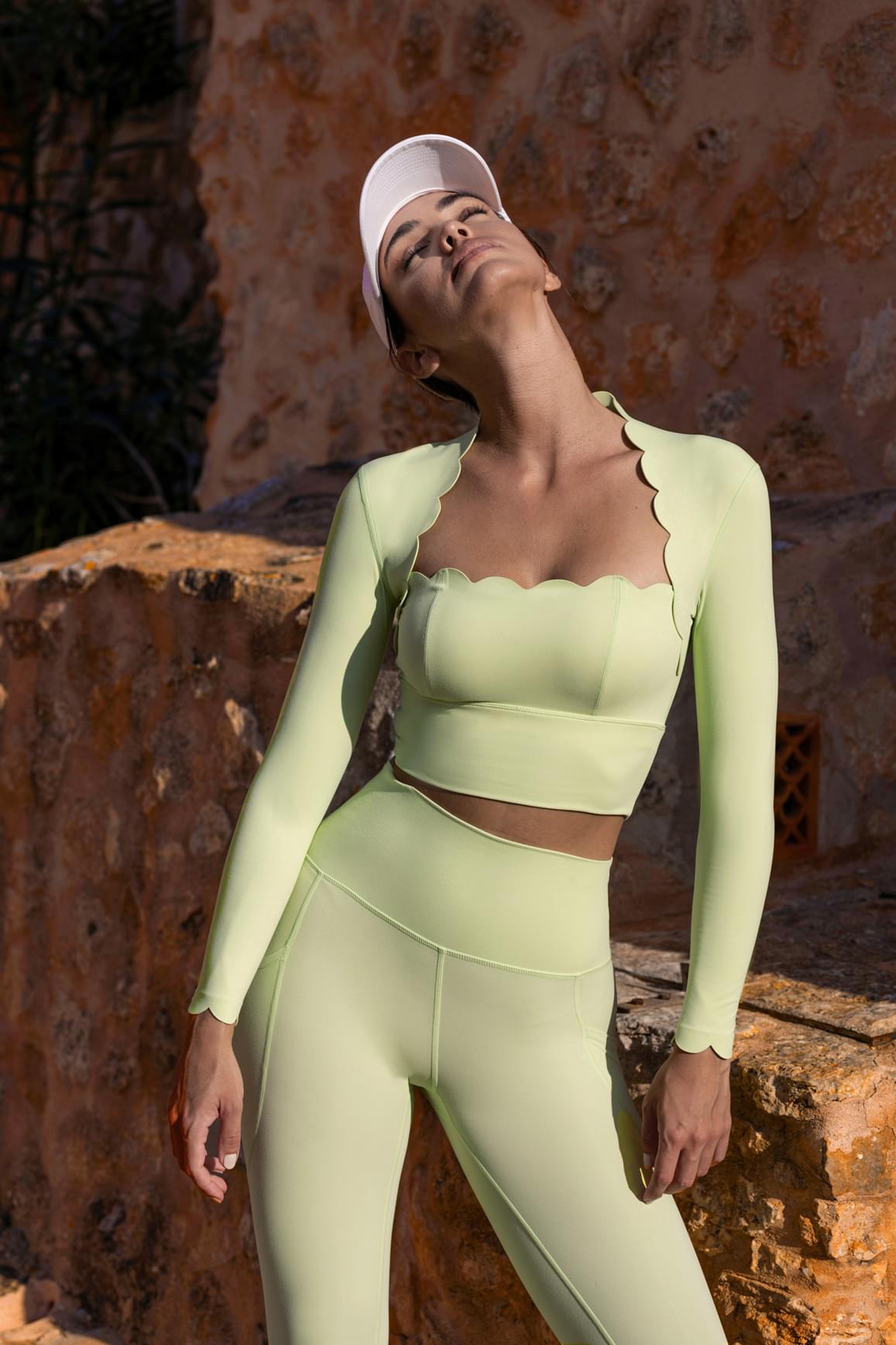 WISKII scallop cropped long sleeve top in sakura zen with mini length, featuring scalloped edges and a fitted design.