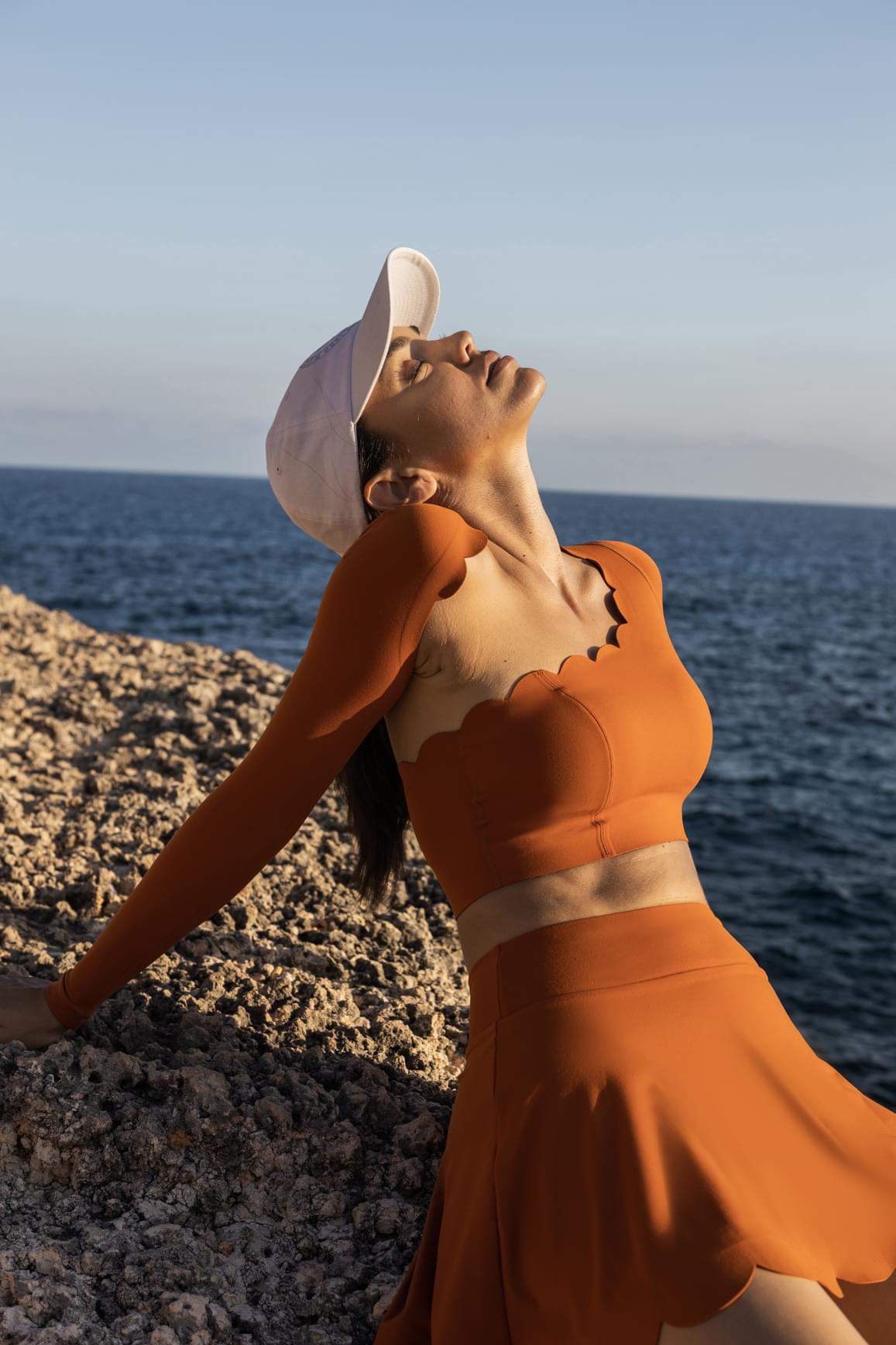 WISKII asymmetrical long sleeve crop top in sakura zen design, stylish crop top with unique asymmetrical cut and long sleeves.