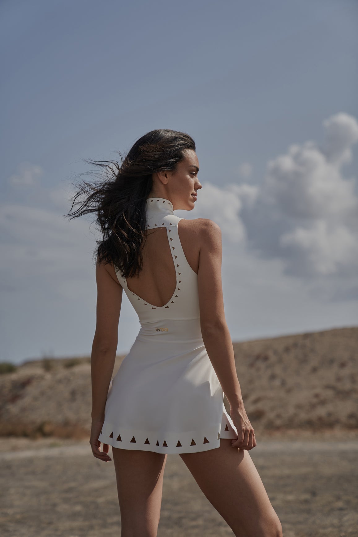 Ivory WISKII Lavish Laser Cut Zip Dress with intricate laser cut details and a stylish zipper front.