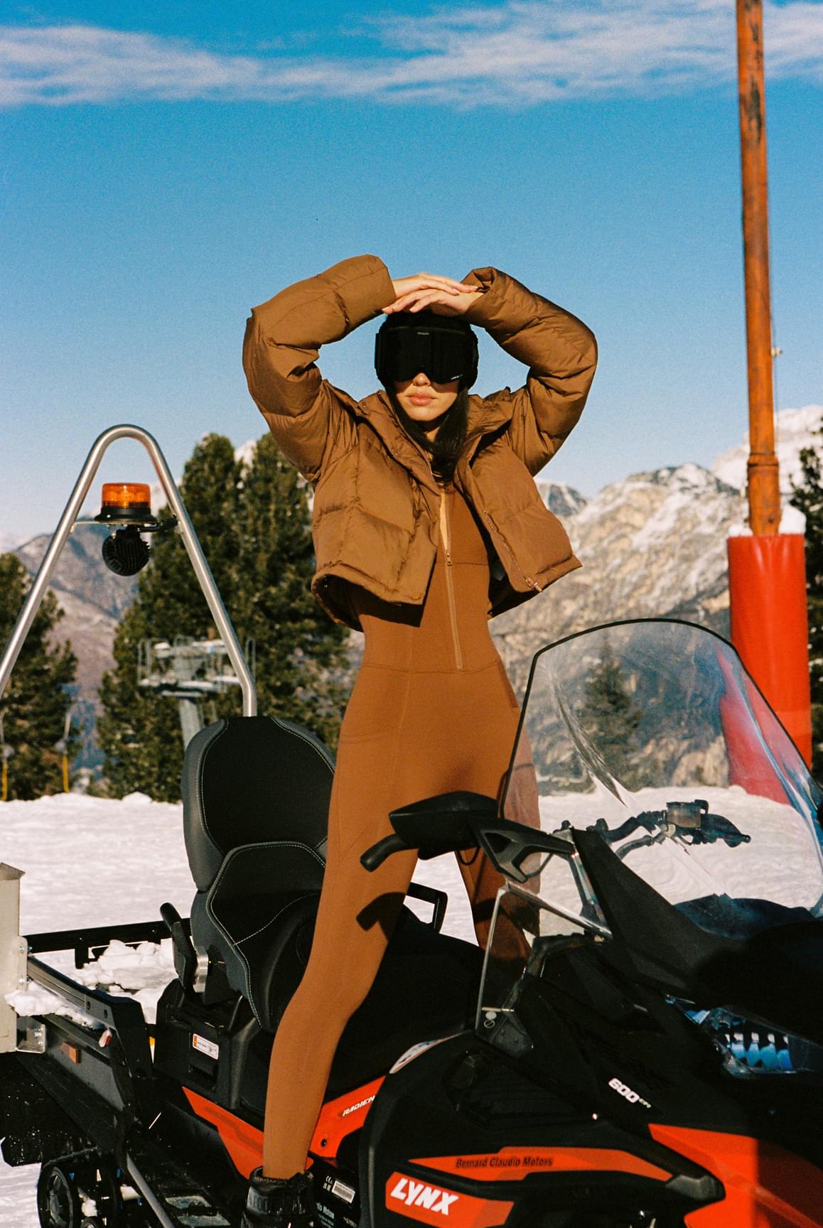 WISKII Ivory Cropped Convert Down Jacket, stylish hooded jacket with down insulation, displayed on a hanger.