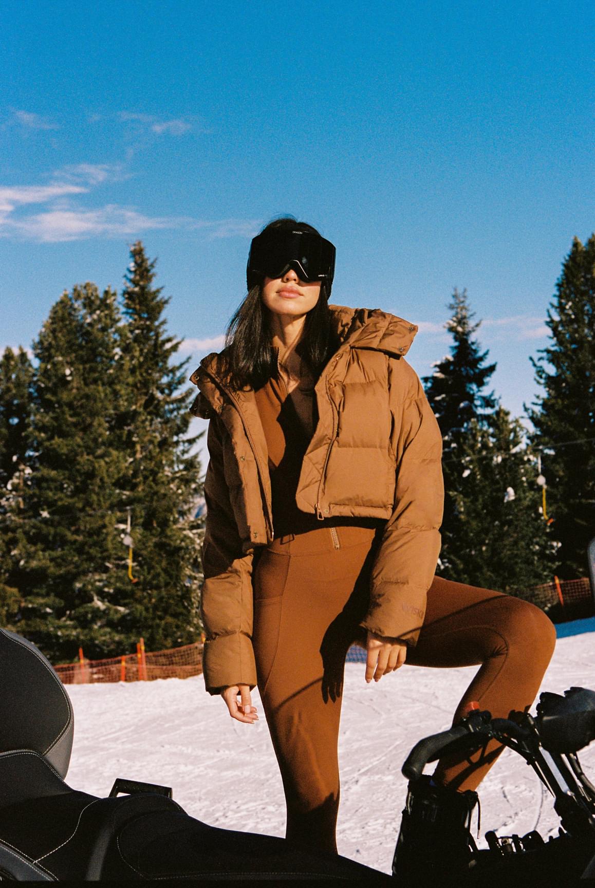 WISKII Ivory Cropped Convert Down Jacket with hood, lightweight puffer style, shown on model with zip closure and ribbed cuffs.