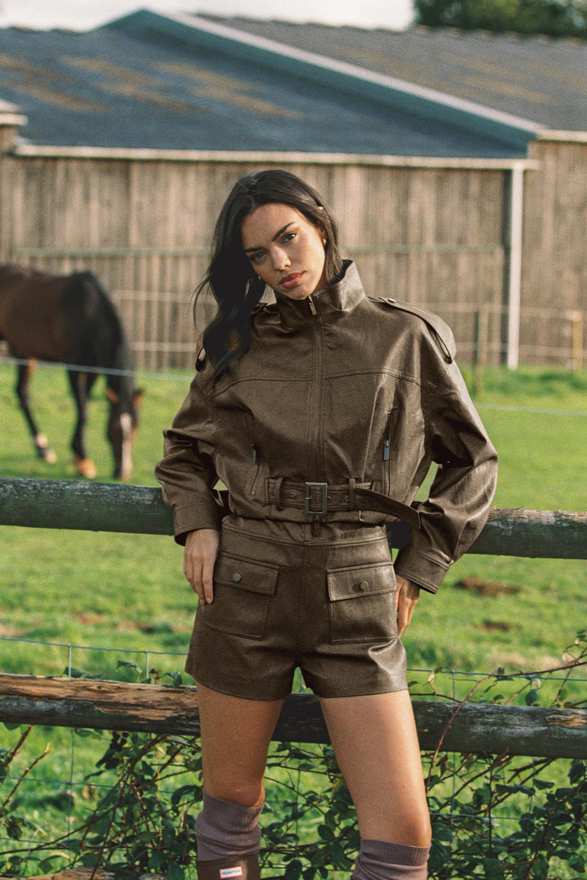 WISKII retro faux leather jacket with quilted detailing and a hood, displayed on a hanger against a neutral background.