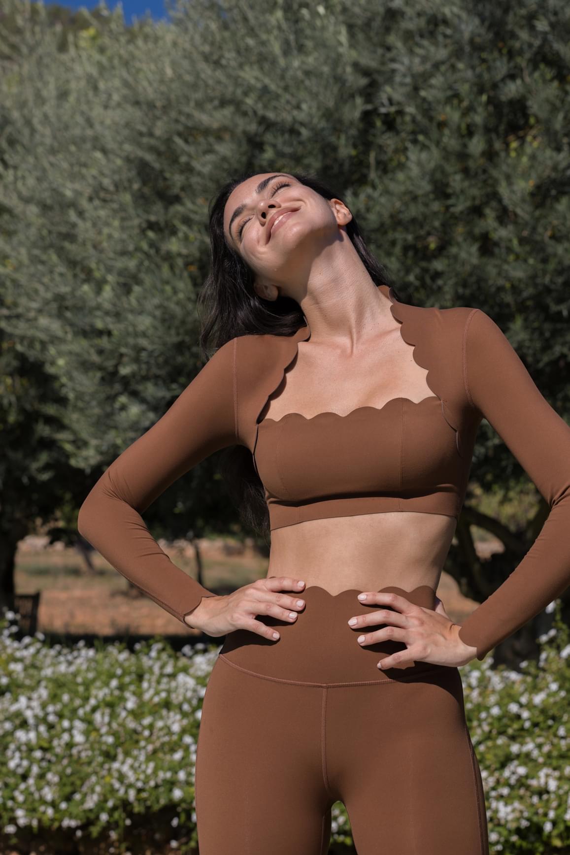 Ivory 7/8 high-waist energy leggings by WISKII, stretchy and form-fitting for active or casual wear, shown on a model.