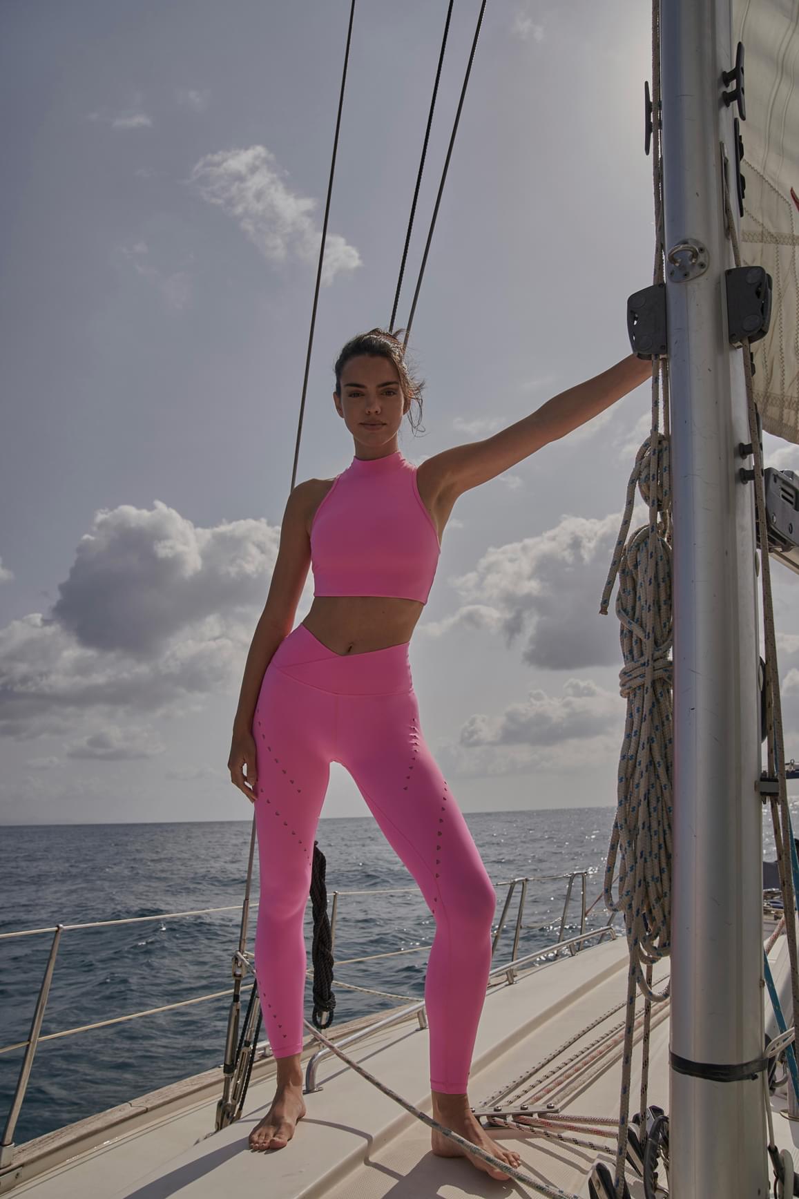 Ivory V-waist laser cut sports leggings by WISKII, showing detailed laser cut design and flexible athletic fit.