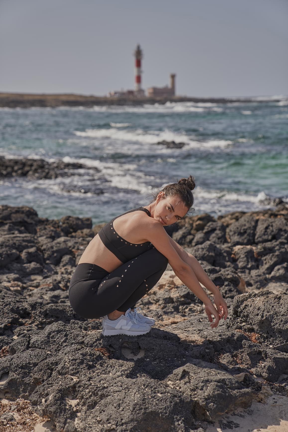 Ivory V-waist laser cut sports leggings by WISKII featuring stylish cut-out details and a comfortable fit for activewear.