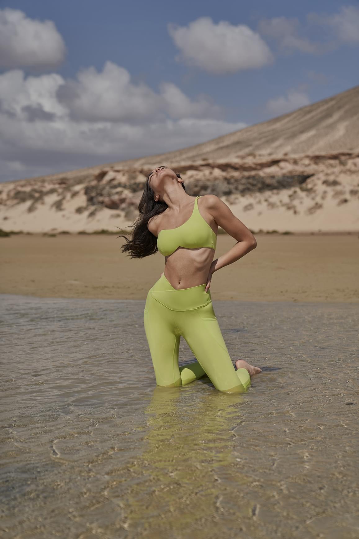 Ivory V-Waist Utility Leggings by WISKII featuring a high waist, stretchy fabric, and functional utility pockets.