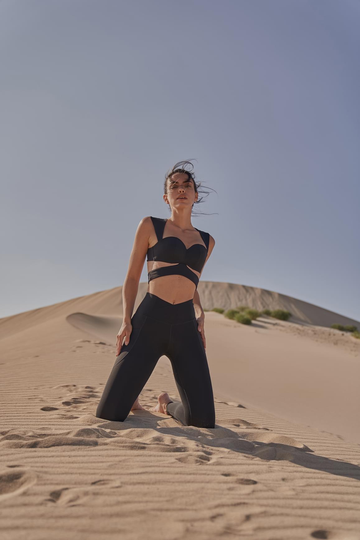 WISKII Ivory V-Waist Utility Leggings shown flat, featuring a high V-waist design and functional utility pockets.
