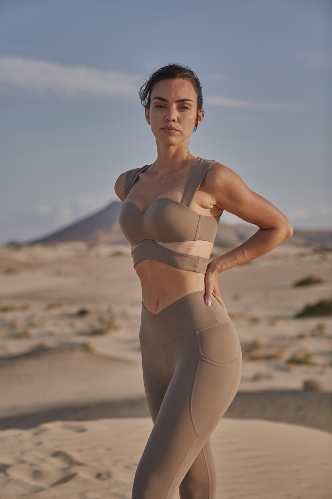 Ivory V-Waist Utility Leggings by WISKII, high-waisted leggings with utility pockets and a sleek fit.