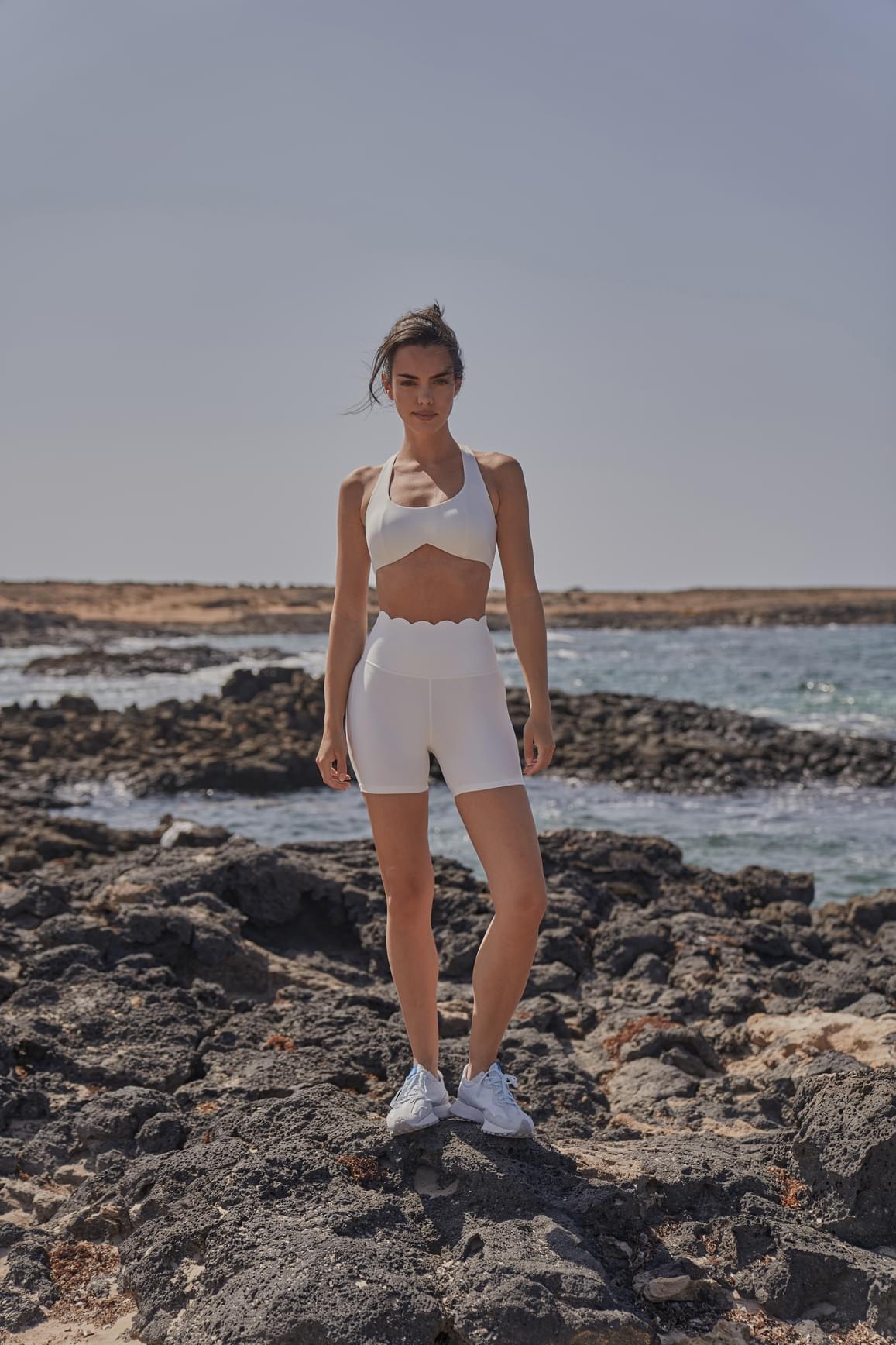Ivory high-waist sculpting biker shorts by WISKII, featuring a snug fit and stretchy fabric for shaping and comfort.