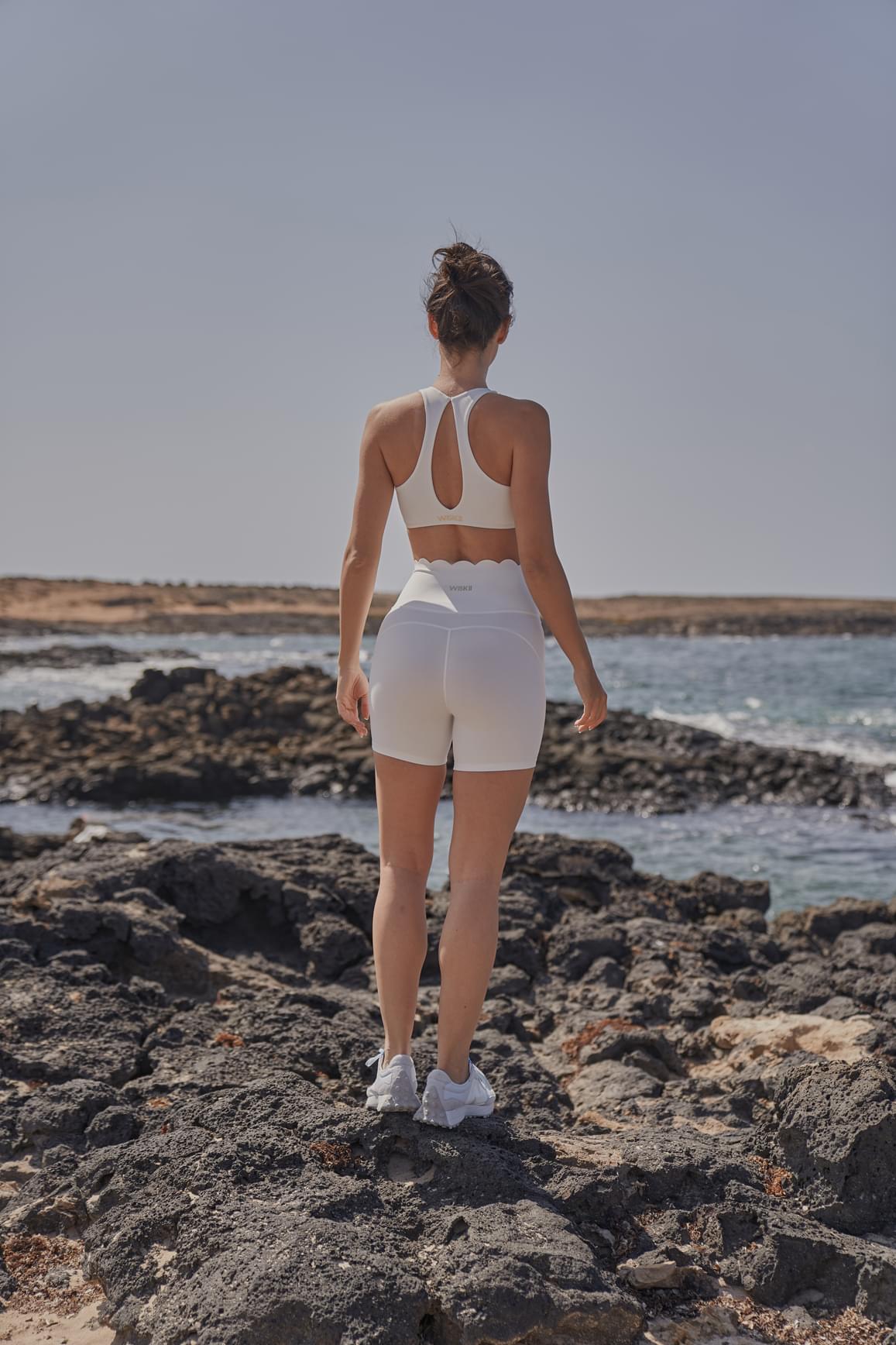 Ivory high-waist sculpting biker shorts by WISKII, with a snug fit and seamless design, perfect for active wear and casual outings.