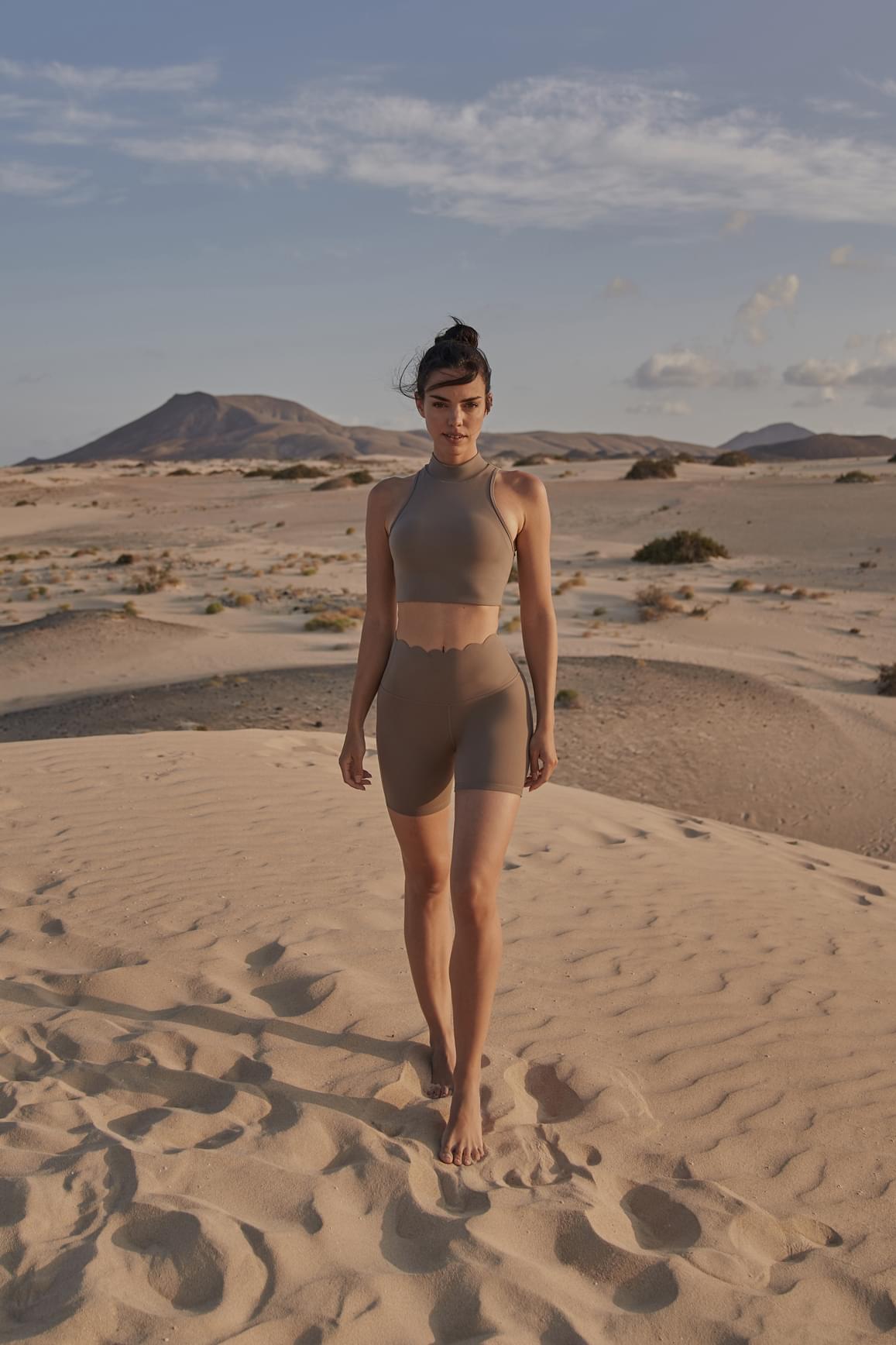 Ivory high-waist sculpting biker shorts by WISKII, designed for a snug fit and flattering silhouette.