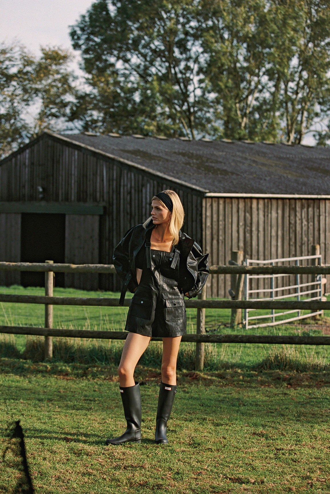WISKII faux leather overall shorts in taupe color, featuring a trendy design with adjustable straps and front pockets.