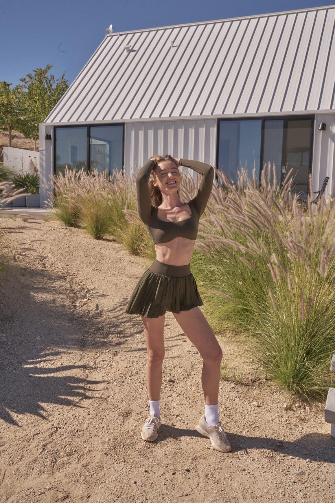 Ivory WISKII Lite pleated skirt with soft fabric and elegant pleats, showcasing a stylish and versatile skirt design.