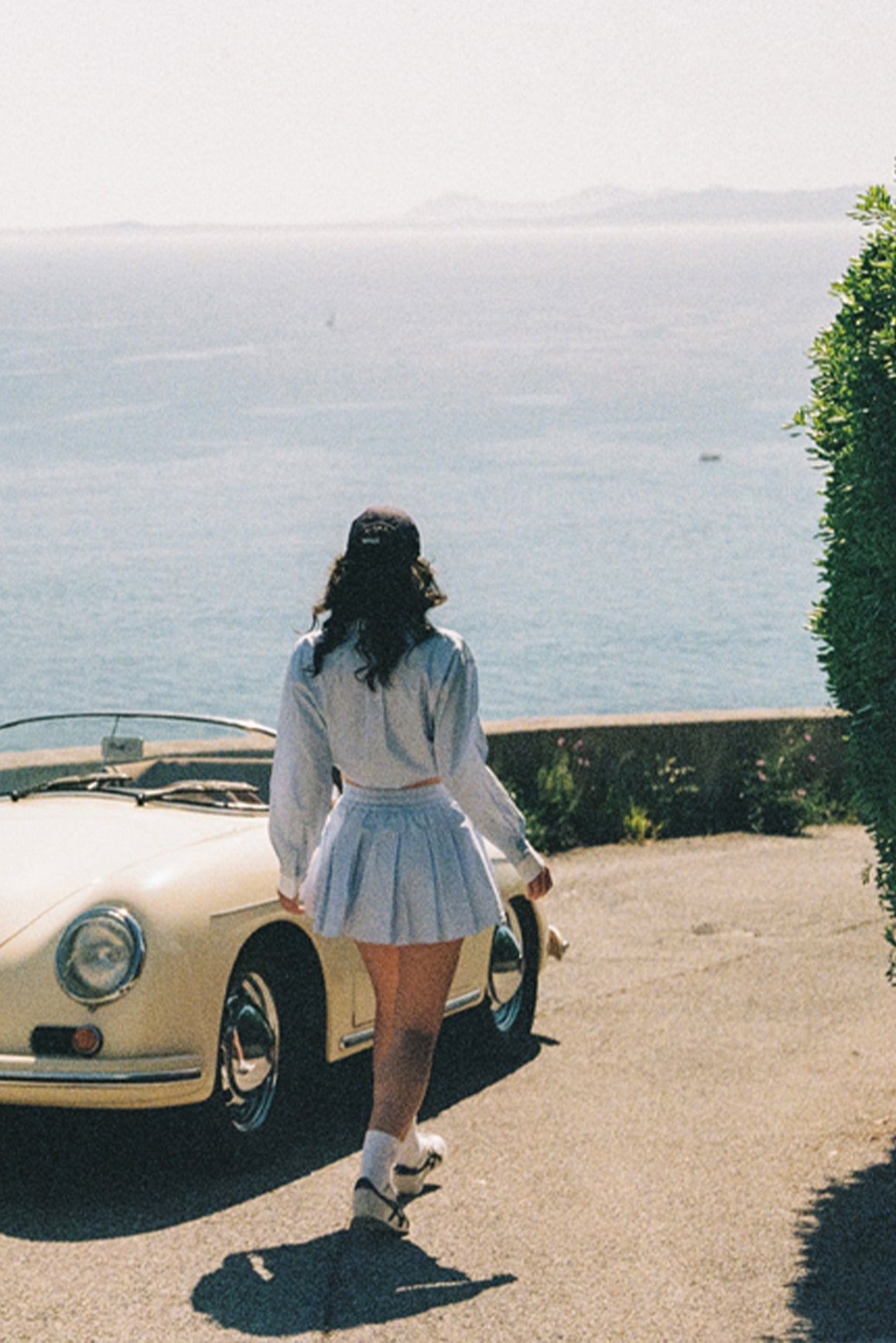 WISKII Riviera relaxed cotton shirt displayed on a hanger, featuring lightweight fabric and a casual, comfortable fit for summer wear.