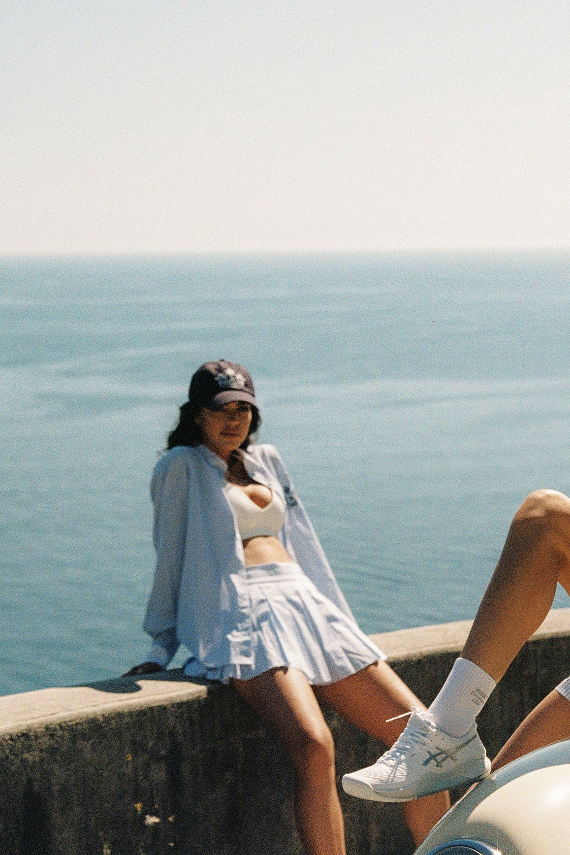 WISKII Riviera Pleated Skirt in summer cloud color, flowing design, knee-length with pleats, perfect for casual or summer wear.