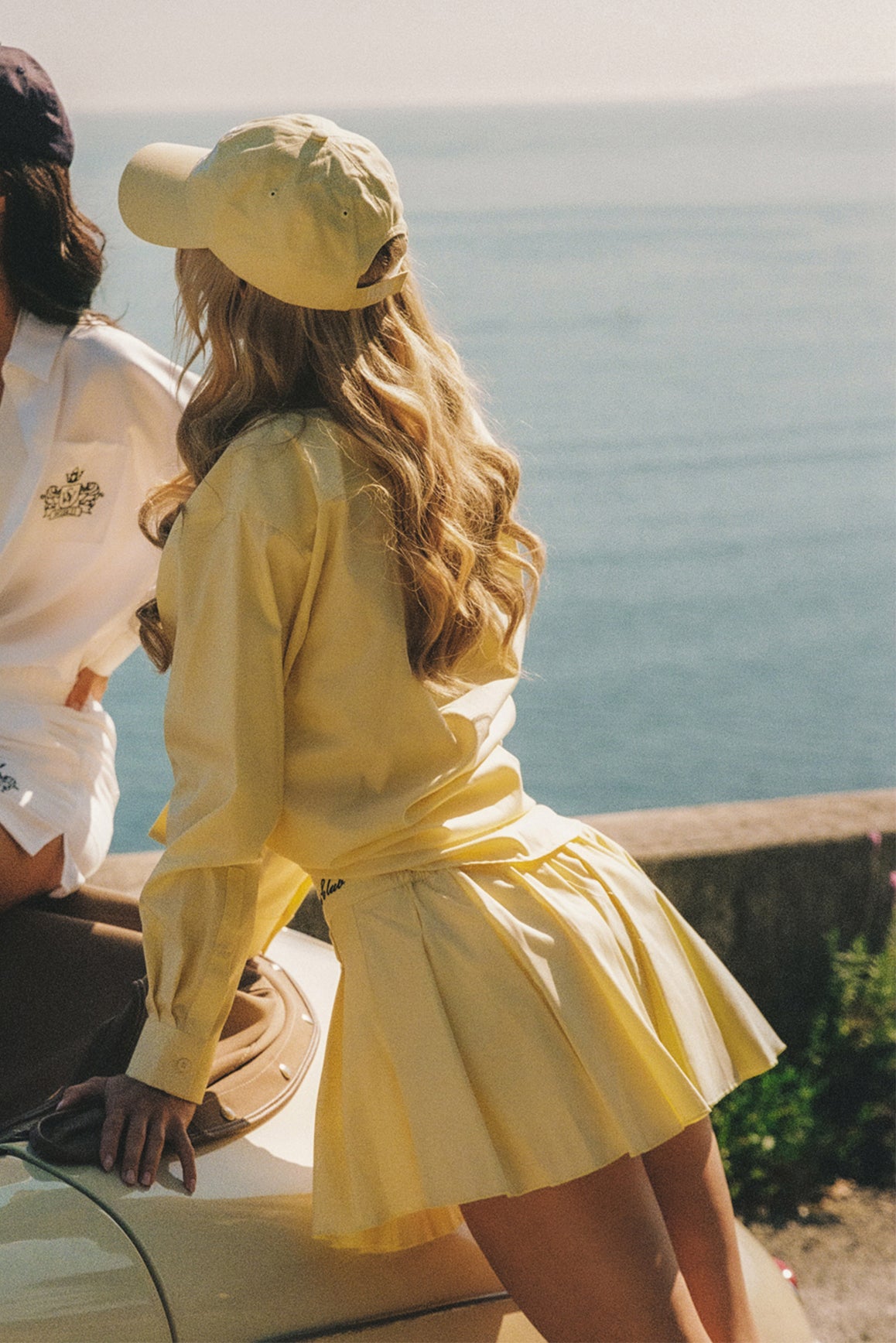 WISKII Riviera Pleated Skirt in summer cloud color, flowing fabric with pleats, perfect for casual or dressy summer outfits.