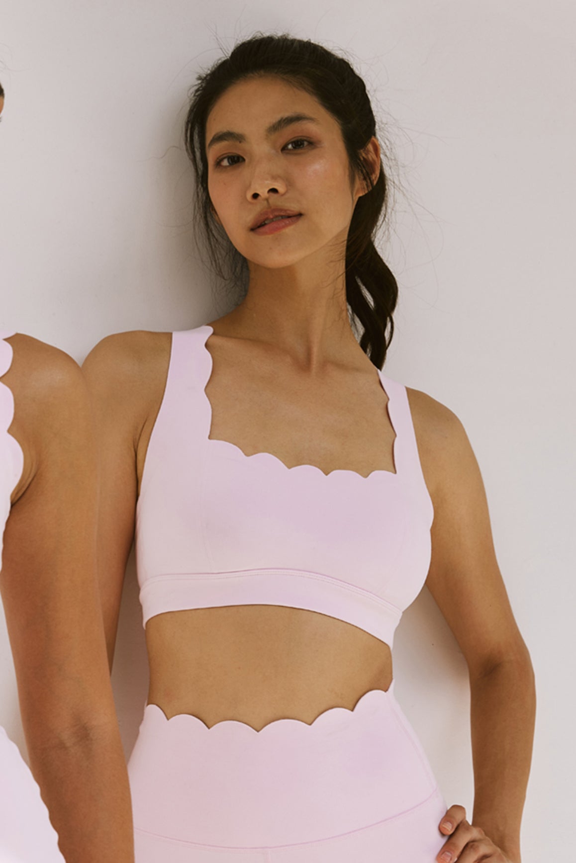 WISKII ivory cross back sports bra with supportive design, ideal for active wear and workout sessions.