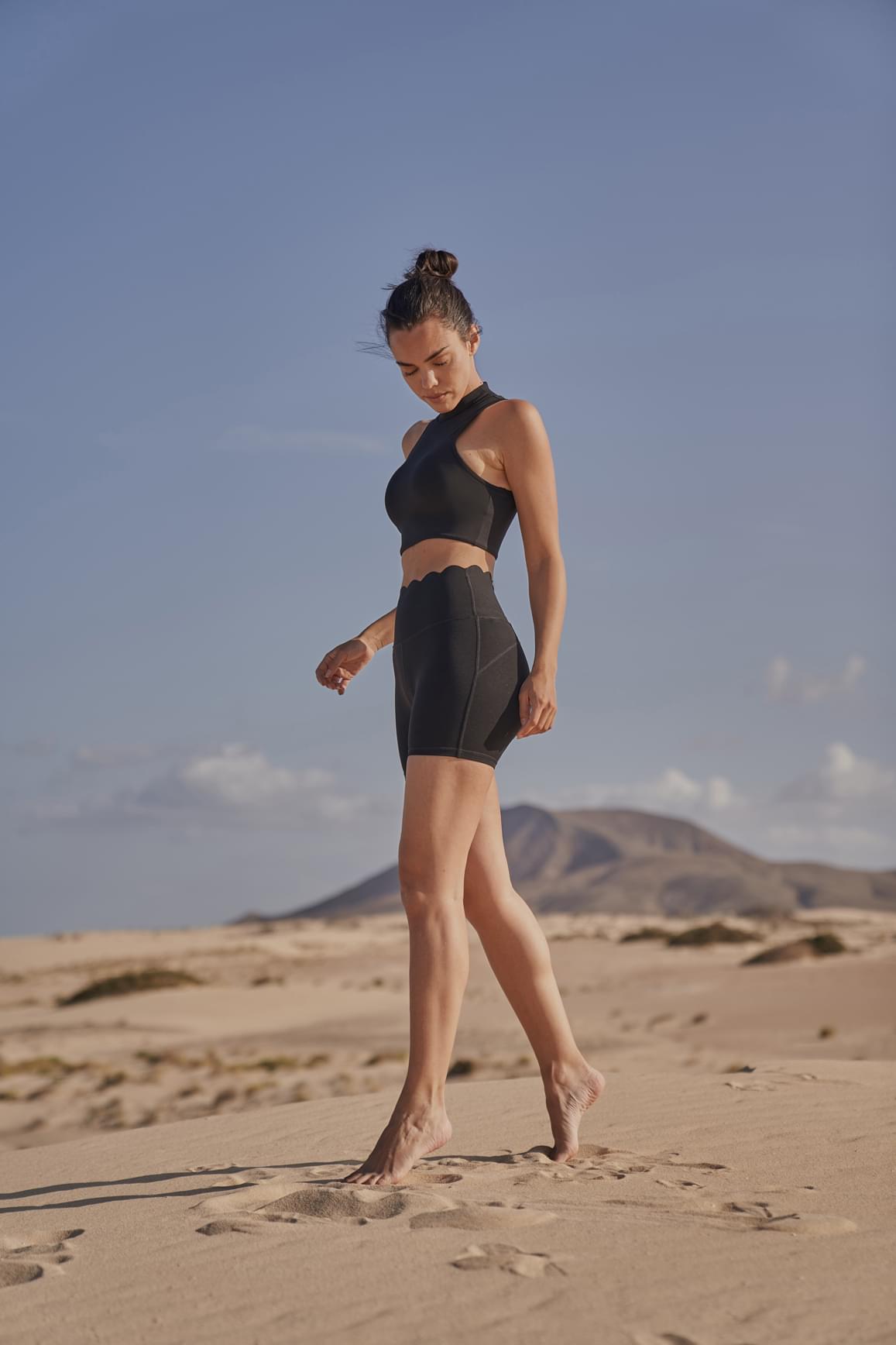 Ivory WISKII sports bra with diamond cutout design and mock neck, featuring a sleek and supportive fit.