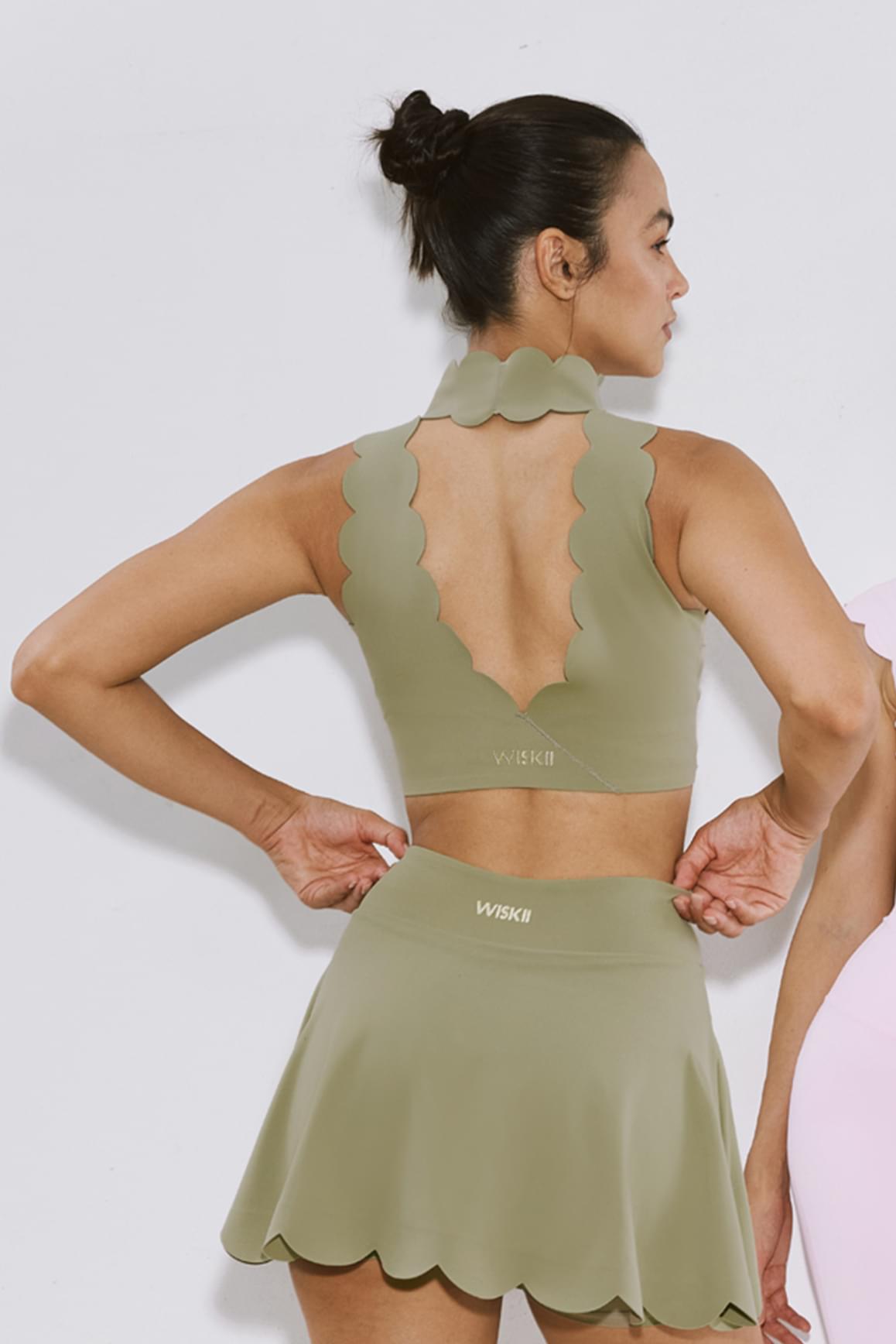 WISKII ivory high neck sports bra with scallop V-back design, providing support and style for active wear.