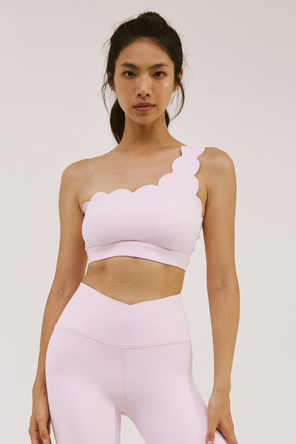 WISKII Dynamic One Shoulder Sports Bra in mulled wine color, featuring a stylish one-shoulder design for active wear.