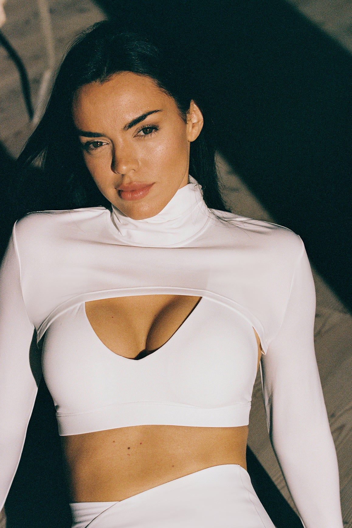 Model wears a Scoop Neck Crossback Bra | WISKII Active | Color Ivory