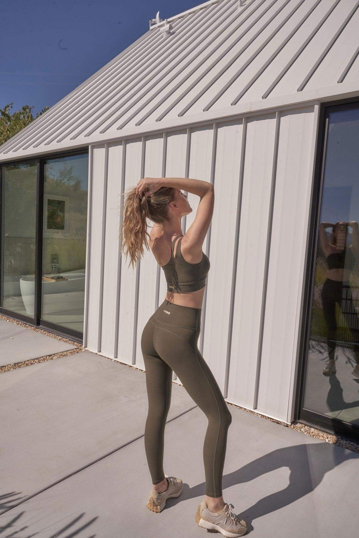 Ivory high-waist training legging by WISKII, showing a close-up of the snug fit and smooth fabric for active wear.