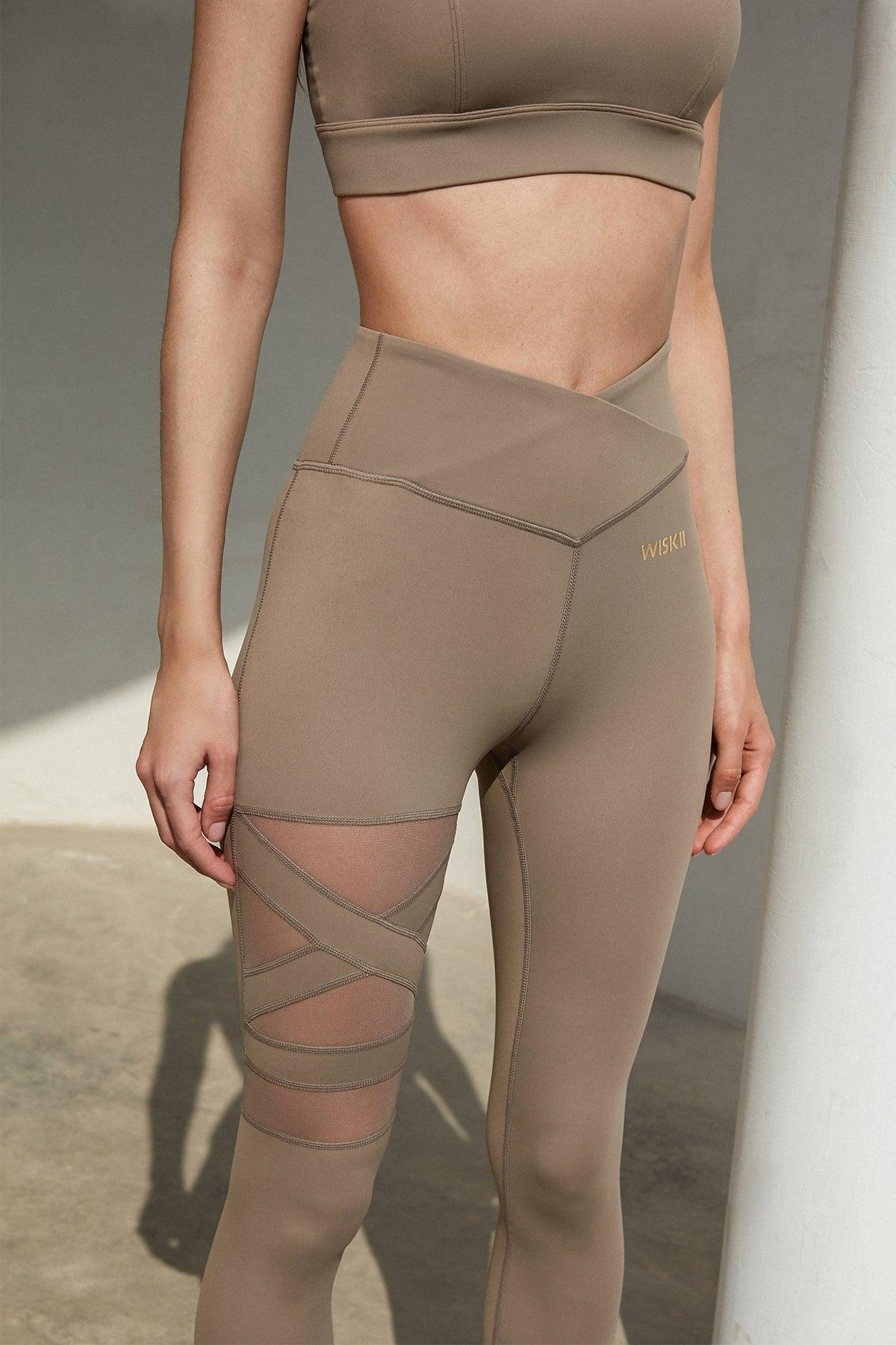 Ivory training mesh leggings by WISKII featuring breathable mesh panels and a snug fit for active wear.