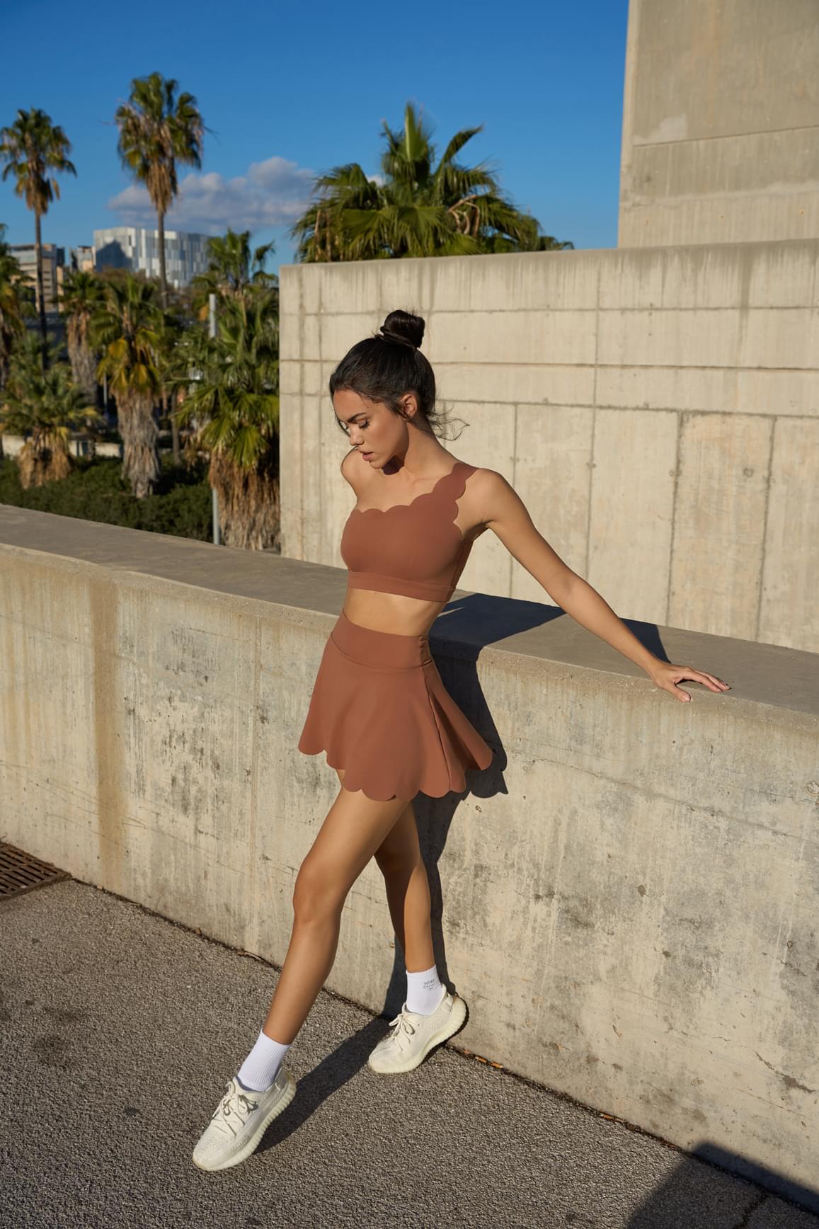 Ivory high-waist A-line tennis skirt by WISKII, featuring a sleek, fitted design perfect for active and casual wear.