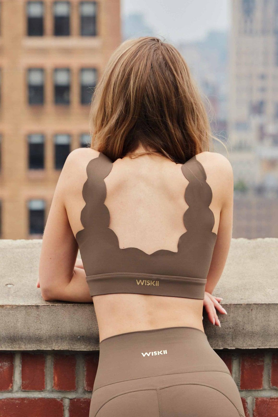 WISKII Soufflé Sports Bra in ivory, designed for support and comfort, with a sleek, seamless fit for active wear.