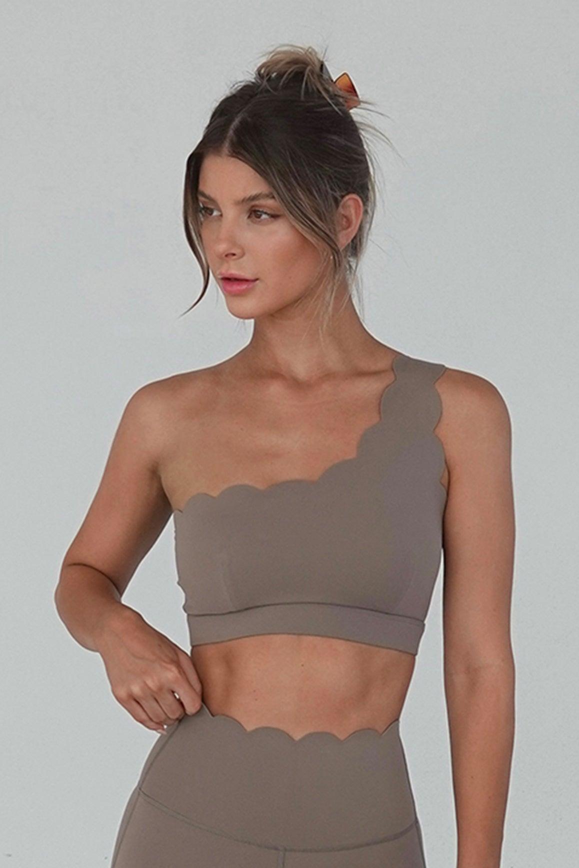 WISKII dynamic one-shoulder sports bra in mulled wine color, featuring a sleek design and supportive fit for active wear.