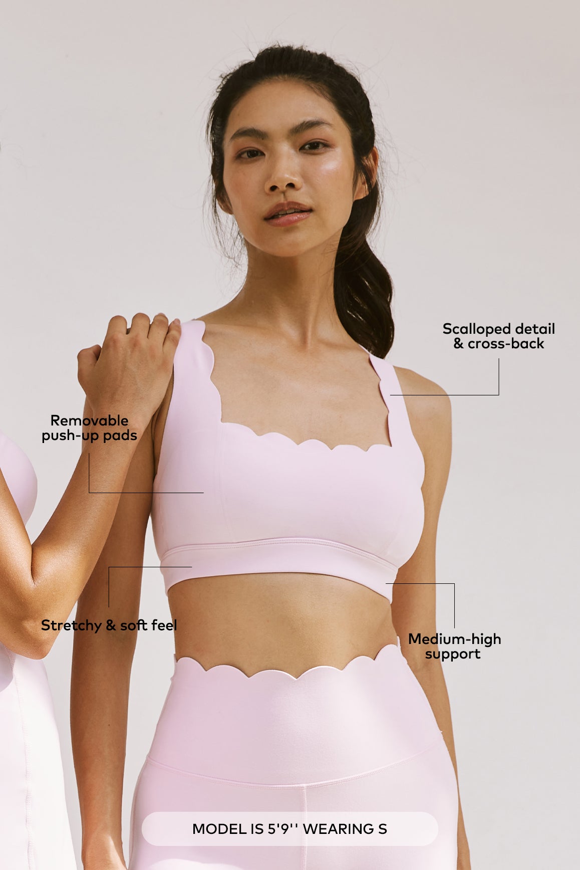 WISKII cross back sports bra in black, featuring a supportive design with crossed straps and breathable fabric for active wear.